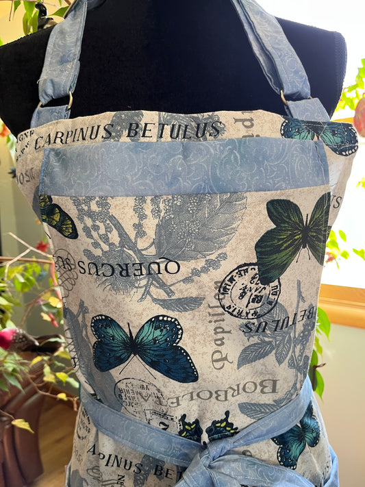 Split-leg Pottery Apron - Butterflies on creamy texture with blue swirl trim