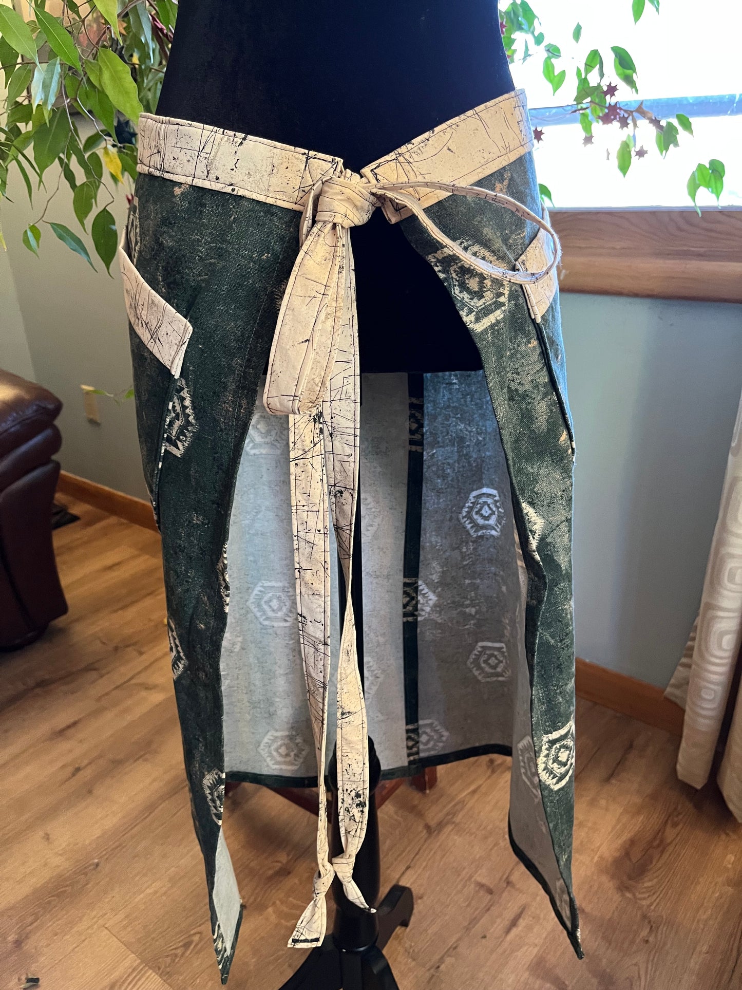 Split-leg Pottery Half Apron - Distressed Cream Medallions on Green with cream & black trim