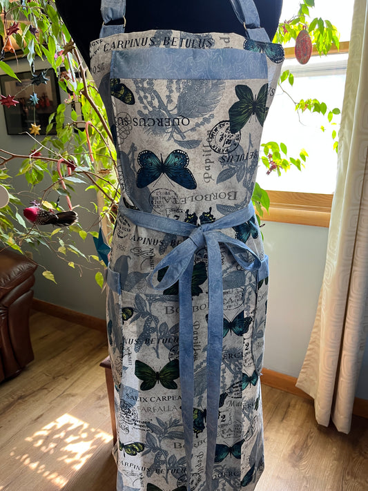 Split-leg Pottery Apron - Butterflies on creamy texture with blue swirl trim